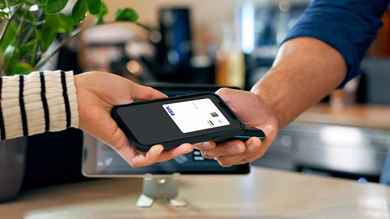 Contactless Visa payment representing global transaction volume