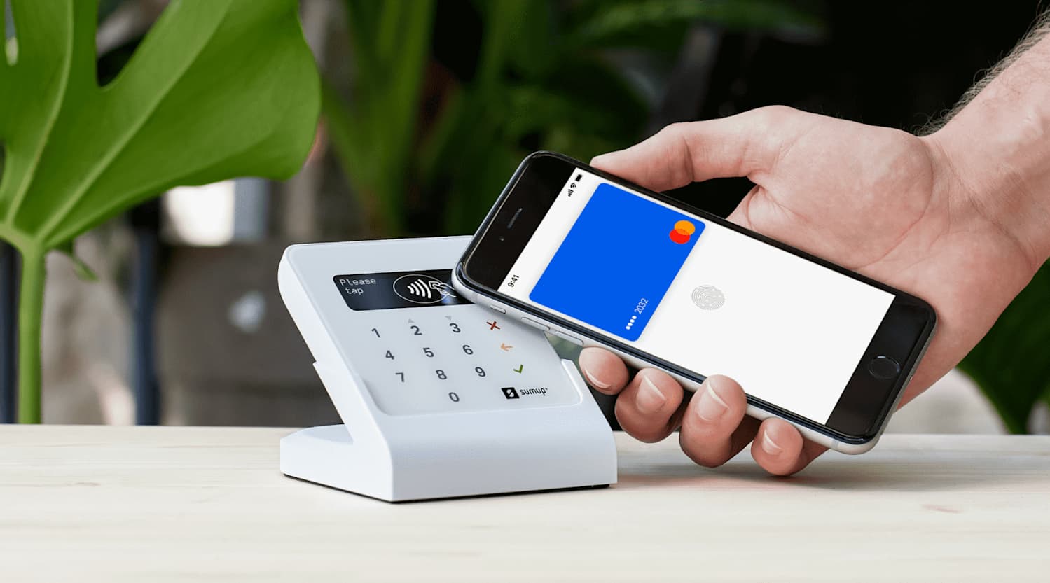 Smartphone making a contactless payment at a point-of-sale terminal