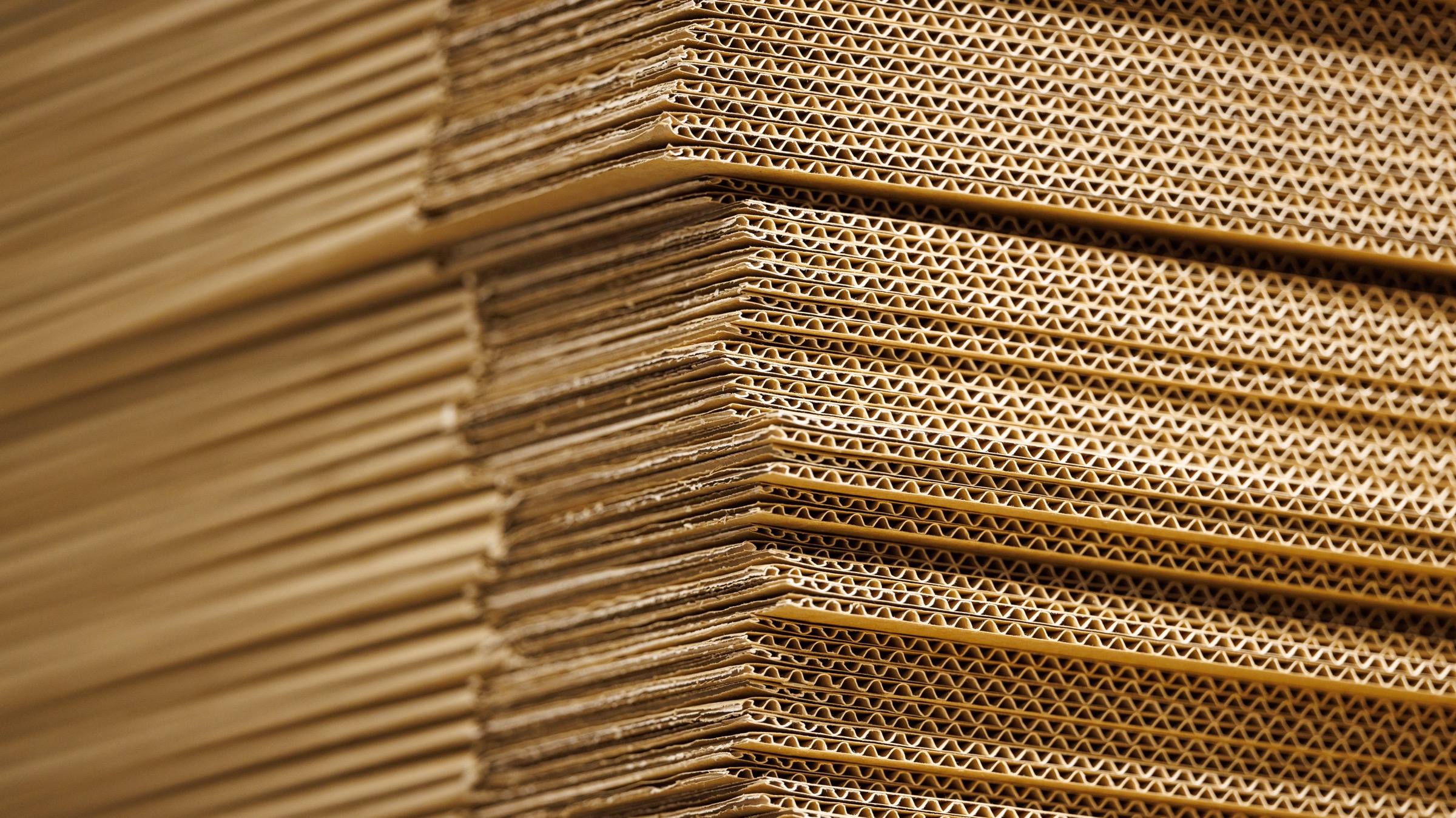 A stack of plain cardboard boxes filling the frame.