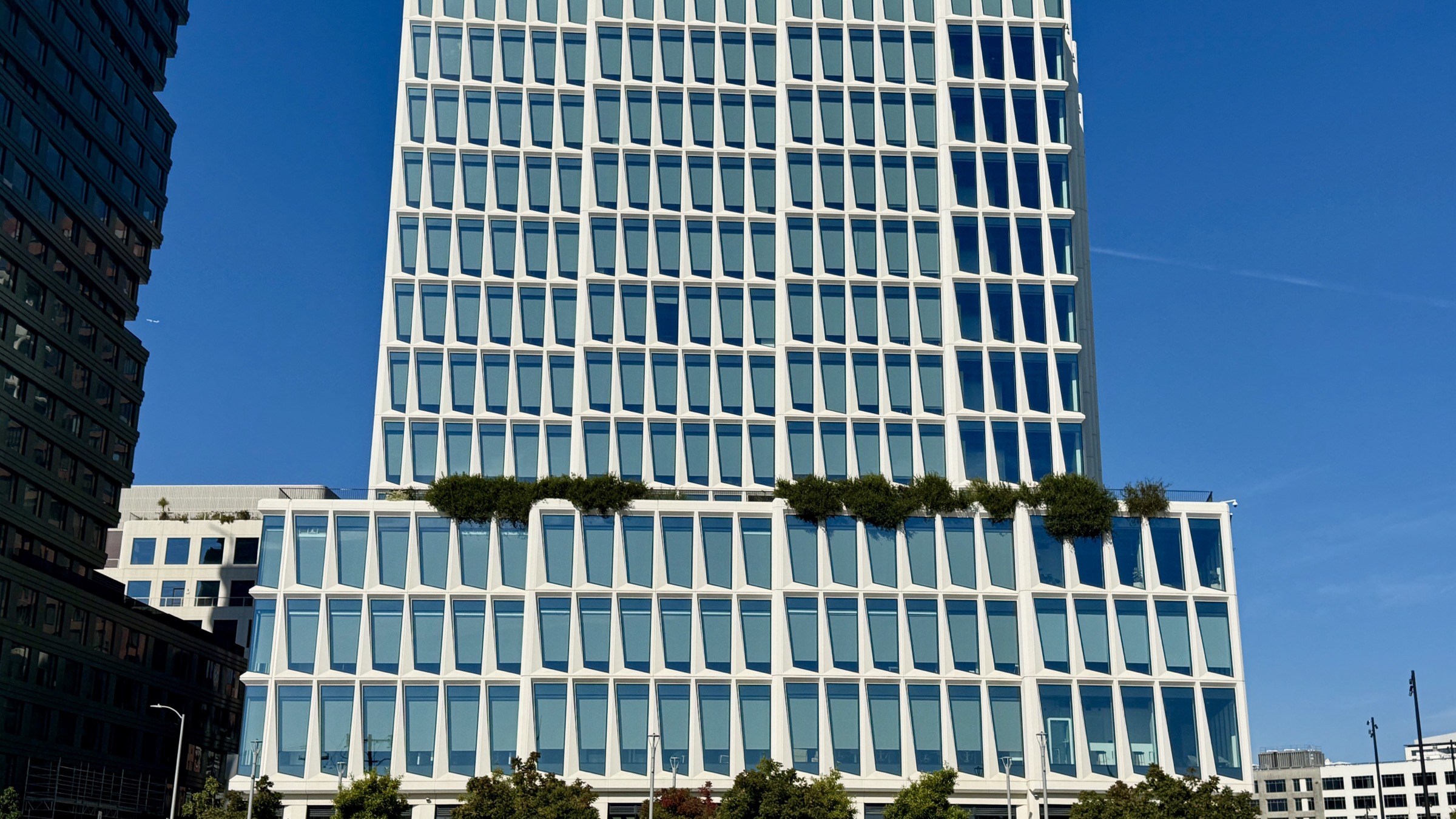 The Visa Inc. headquarters office building, photographed from the street on a clear day.